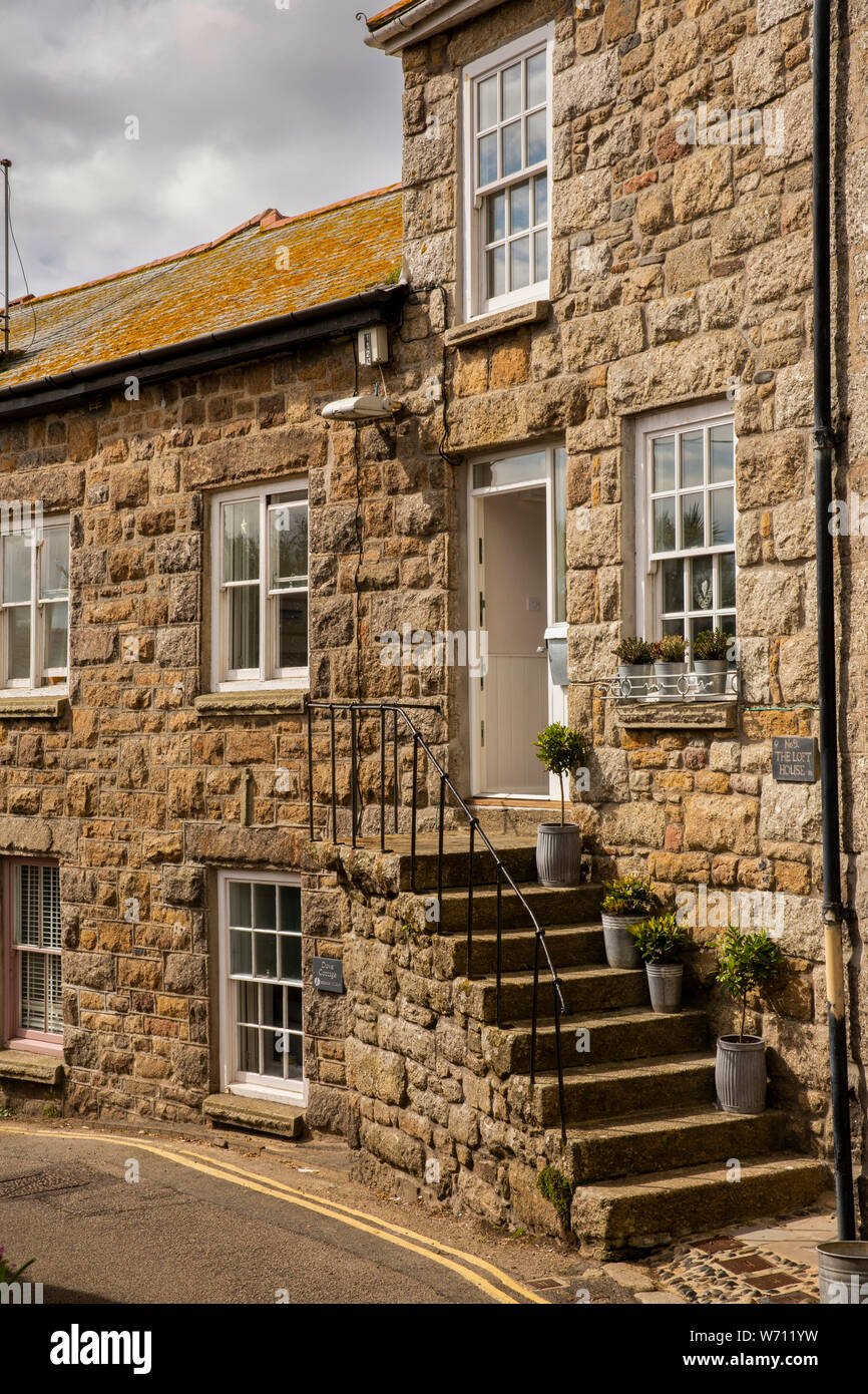 UK, England, Cornwall, Mousehole, Commercial Road, steps up to The Loft House in 1890 stone built terrace Stock Photo