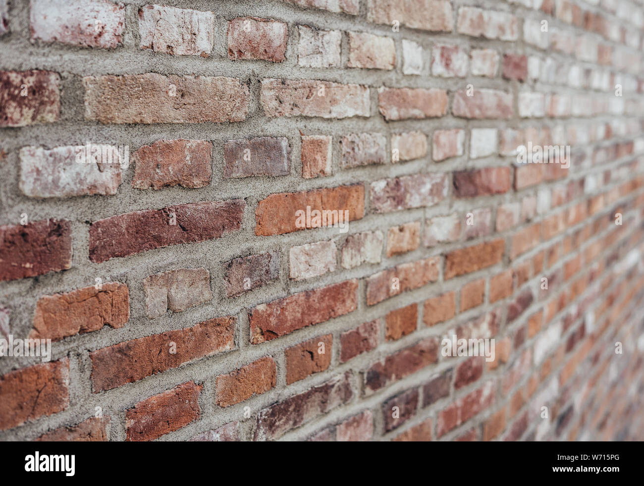 red brown stone brick wall lateral close-up Stock Photo