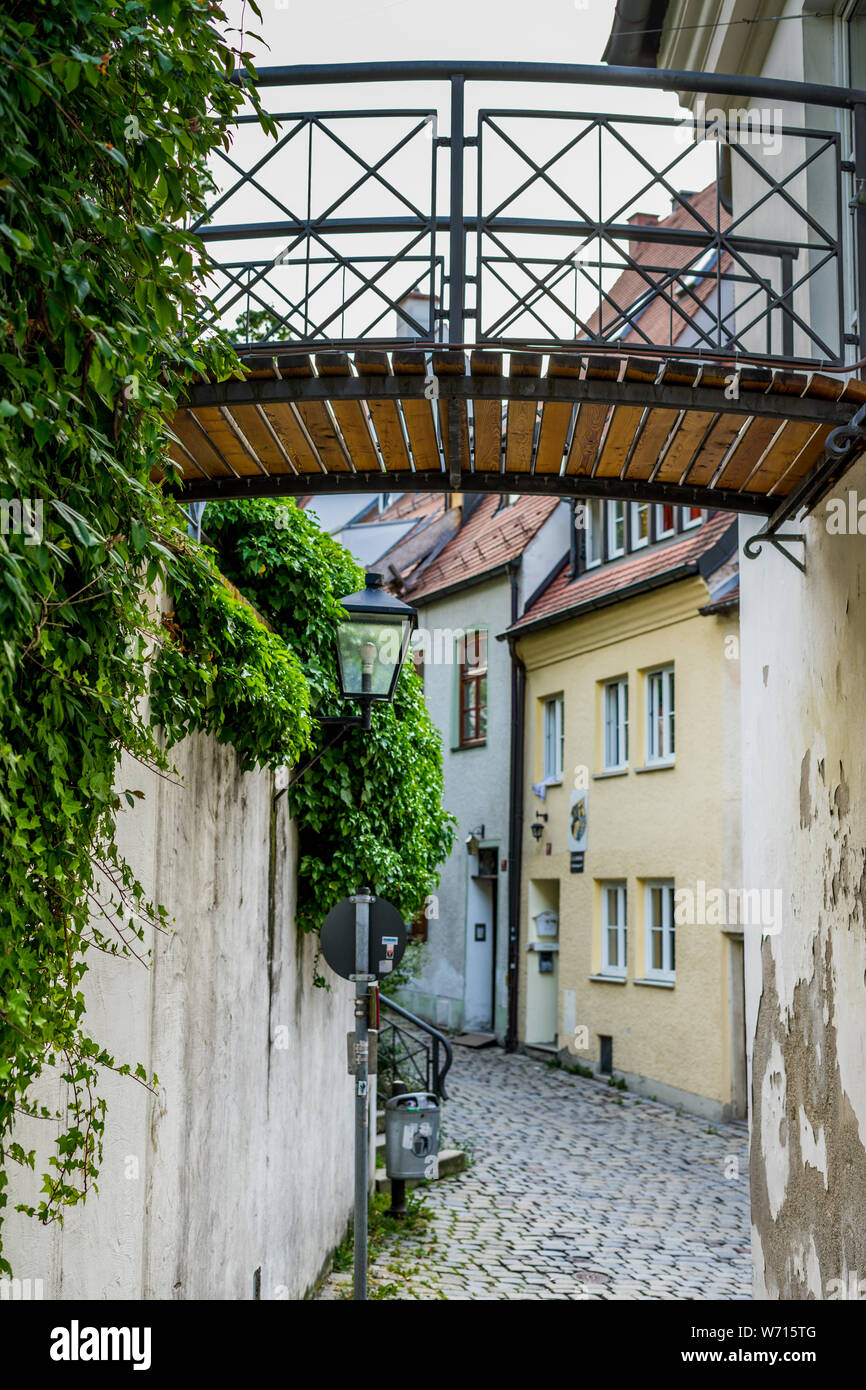 rows of houses with a narrow alley and a bridge over this Stock Photo