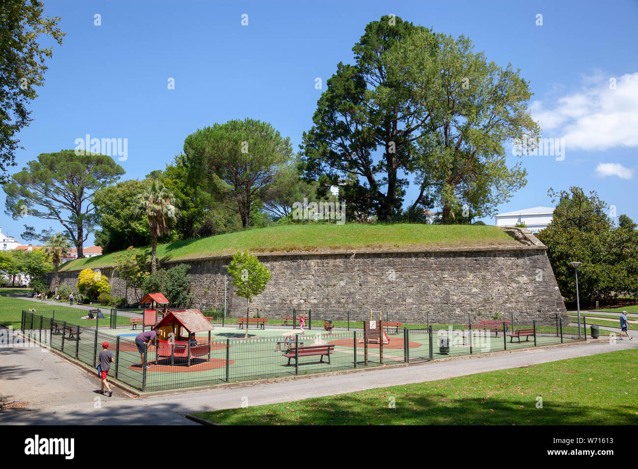 A playground at the foot of the Bayonne's ramparts (Atlantic Pyrenees - France).Aire de jeux aux pieds des remparts du centre-ville de Bayonne. Stock Photo