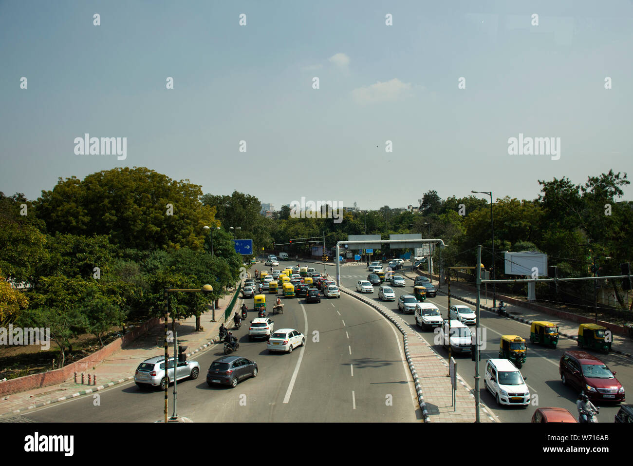 Indian people and foreigners drive car and ride motorcycle and bike