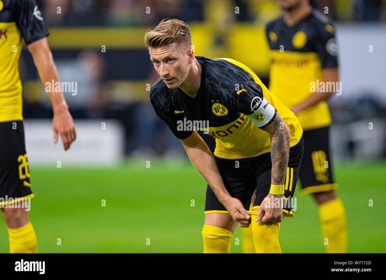 03 August 2019 North Rhine Westphalia Dortmund Soccer Dfl Supercup Borussia Dortmund Bayern Munich In Signal Iduna Park Dortmund S Marco Reus Pulls Up His Socks Photo Guido Kirchner Dpa Important Note In