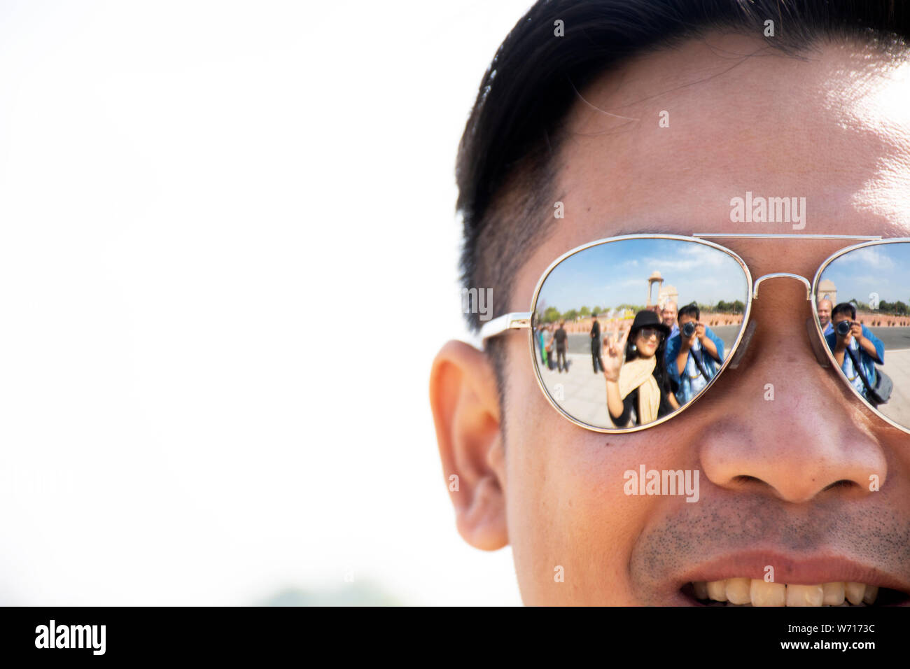 Travelers thai people men and women portrait posing for take photo from reflection of sunglasses at Red Fort of ancient Delhi city on March 18, 2019 i Stock Photo