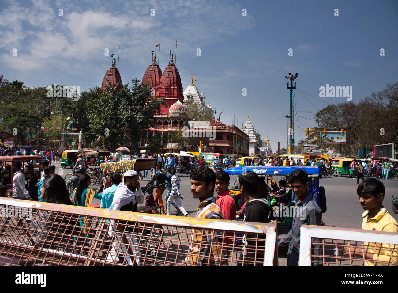 Indian people and foreigners drive car and ride and bike and walk on