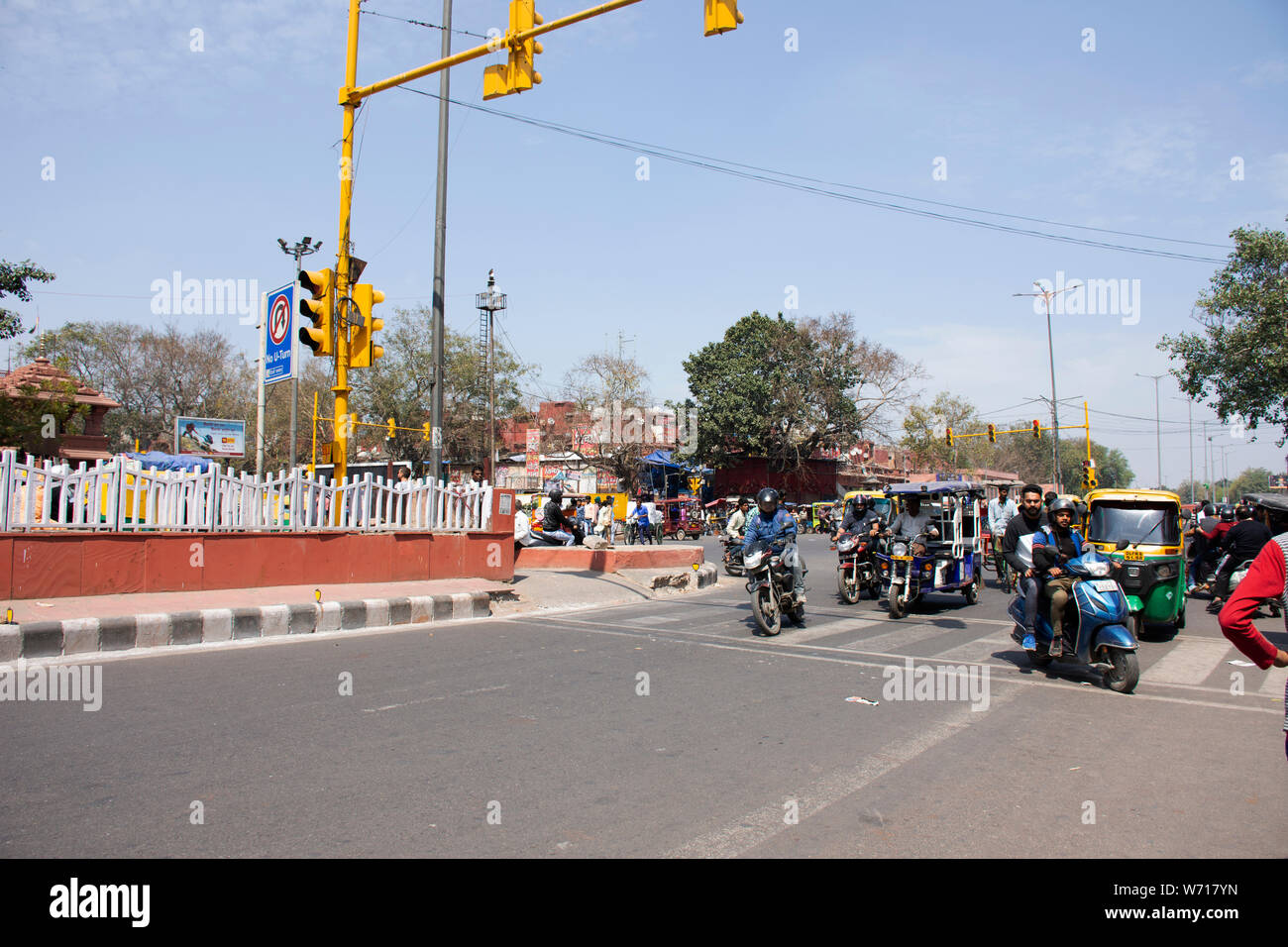 Indian people and foreigners drive car and ride motorcycle and bike