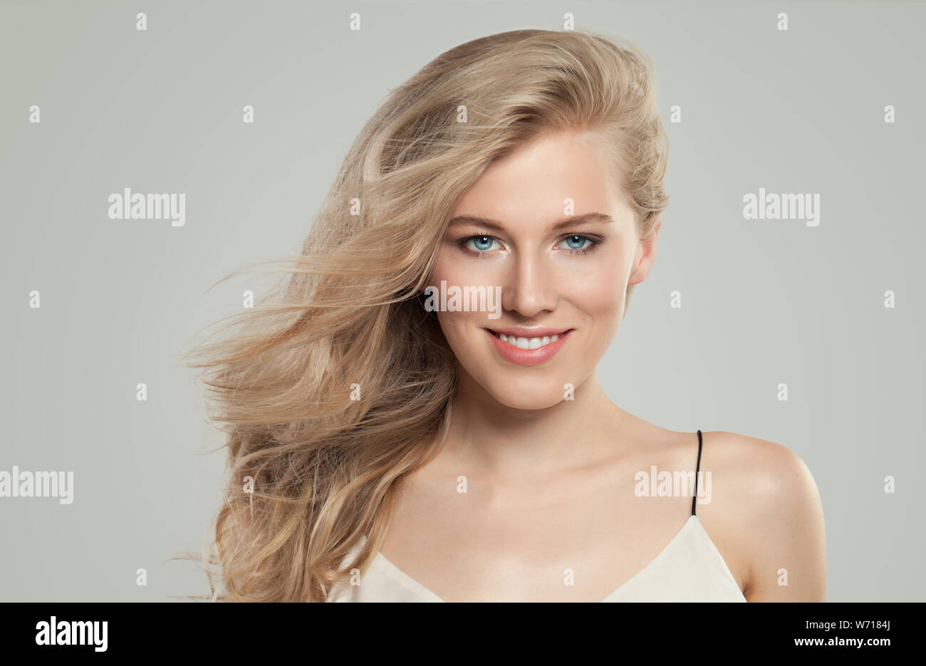 Beautiful Woman With Perfect Blonde Hairstyle And Clear Skin