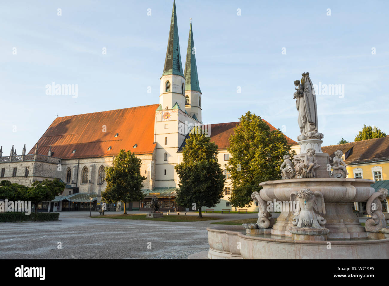 Early morning sun lighting the church at pilgrimage town Altotting in Germany Stock Photo