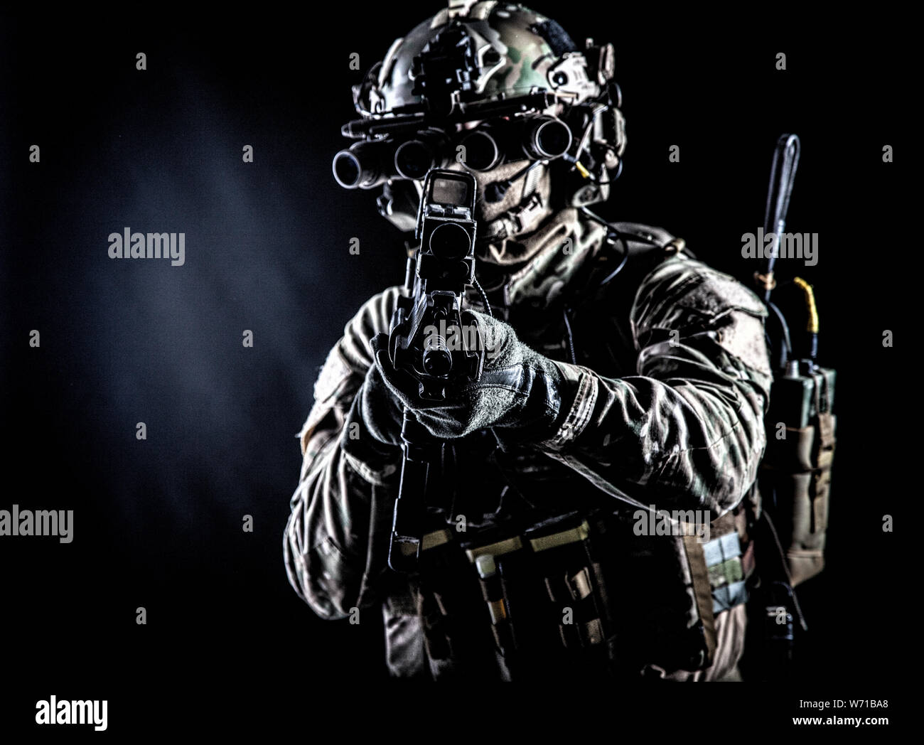 Army soldier aiming rifle in camera in darkness Stock Photo Alamy