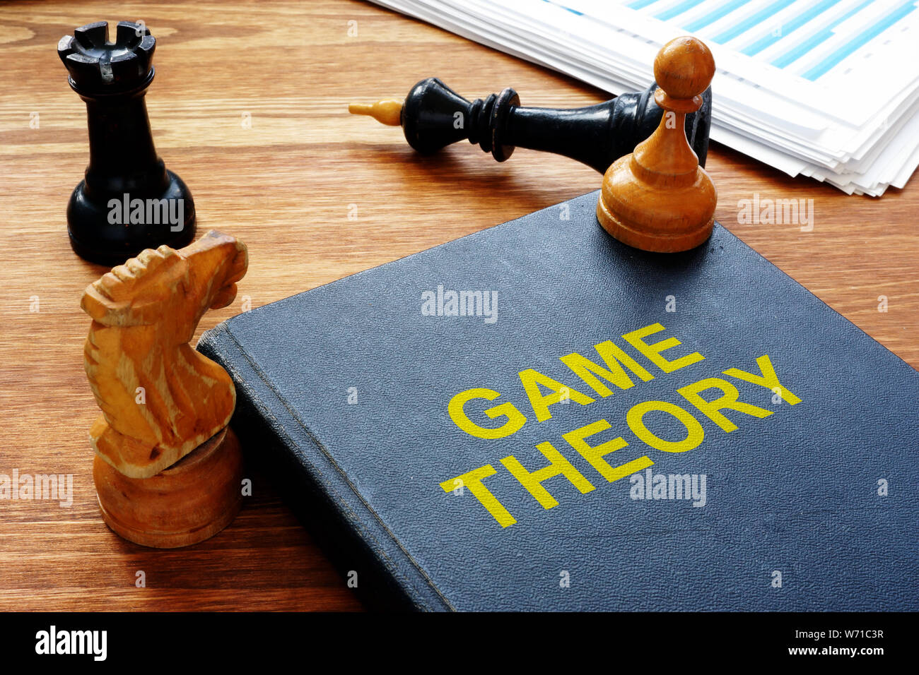 Game theory book and chess with documents. Stock Photo