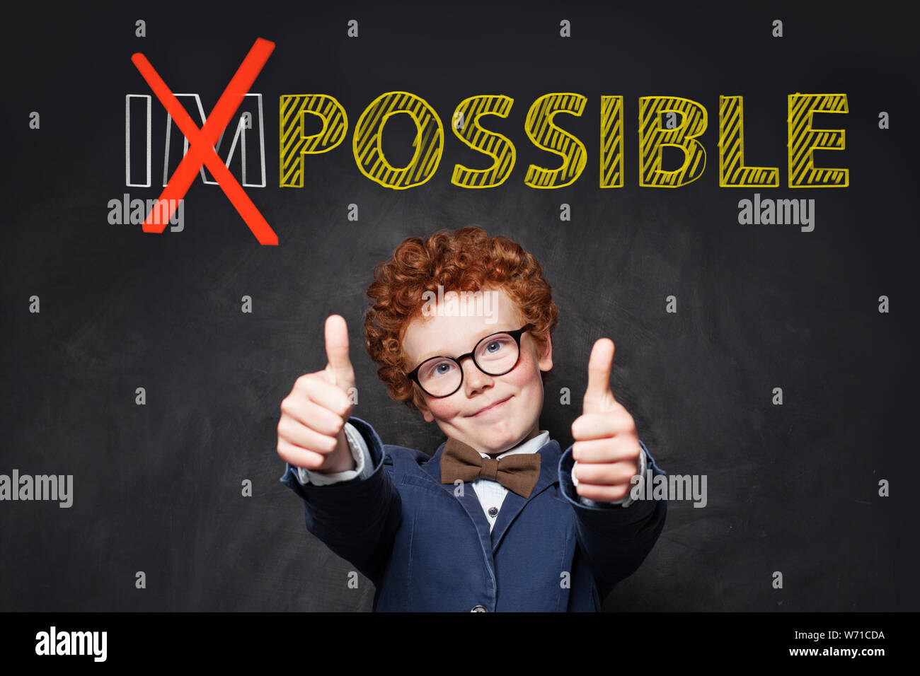 Smart boy student showing thumb up on blackboard background Stock Photo ...