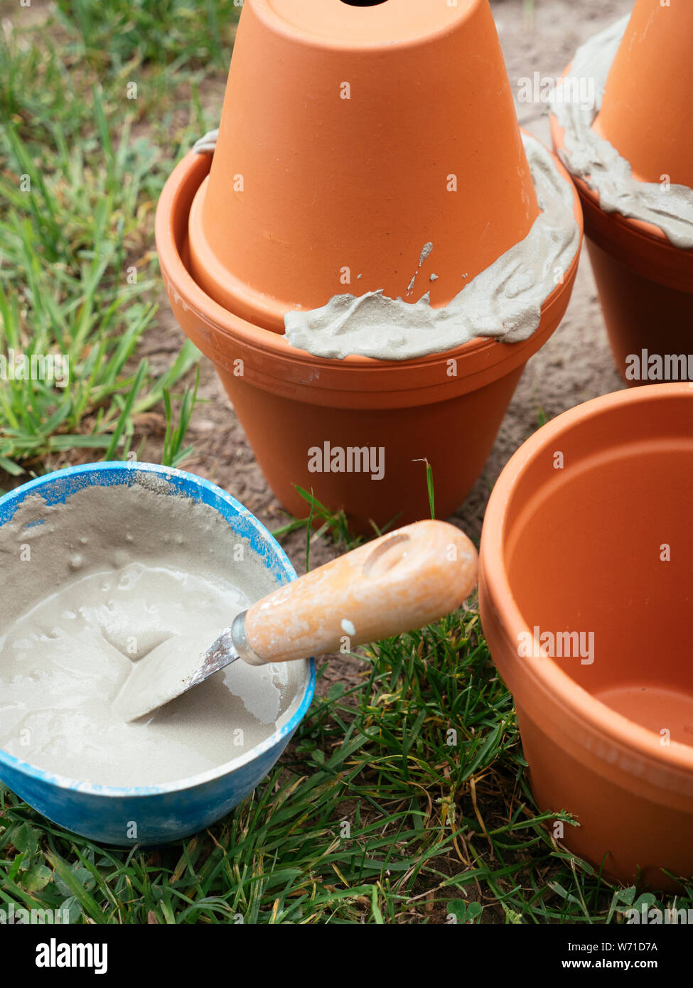 Making clay pot iirrigation system using unglazed terracotta pots Stock
