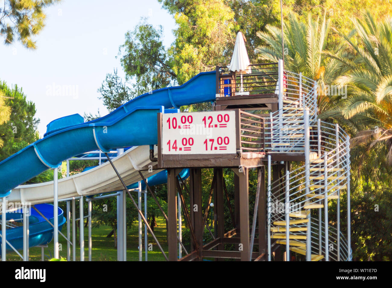 Plate with the mode of operation of the slides of the water park. Stock Photo