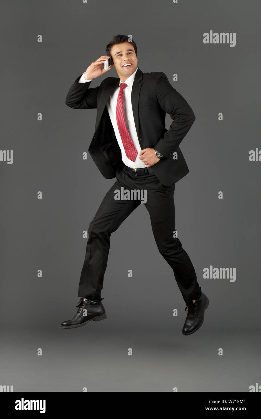 Man Mobile Phone Jumping Joy High Resolution Stock Photography and ...