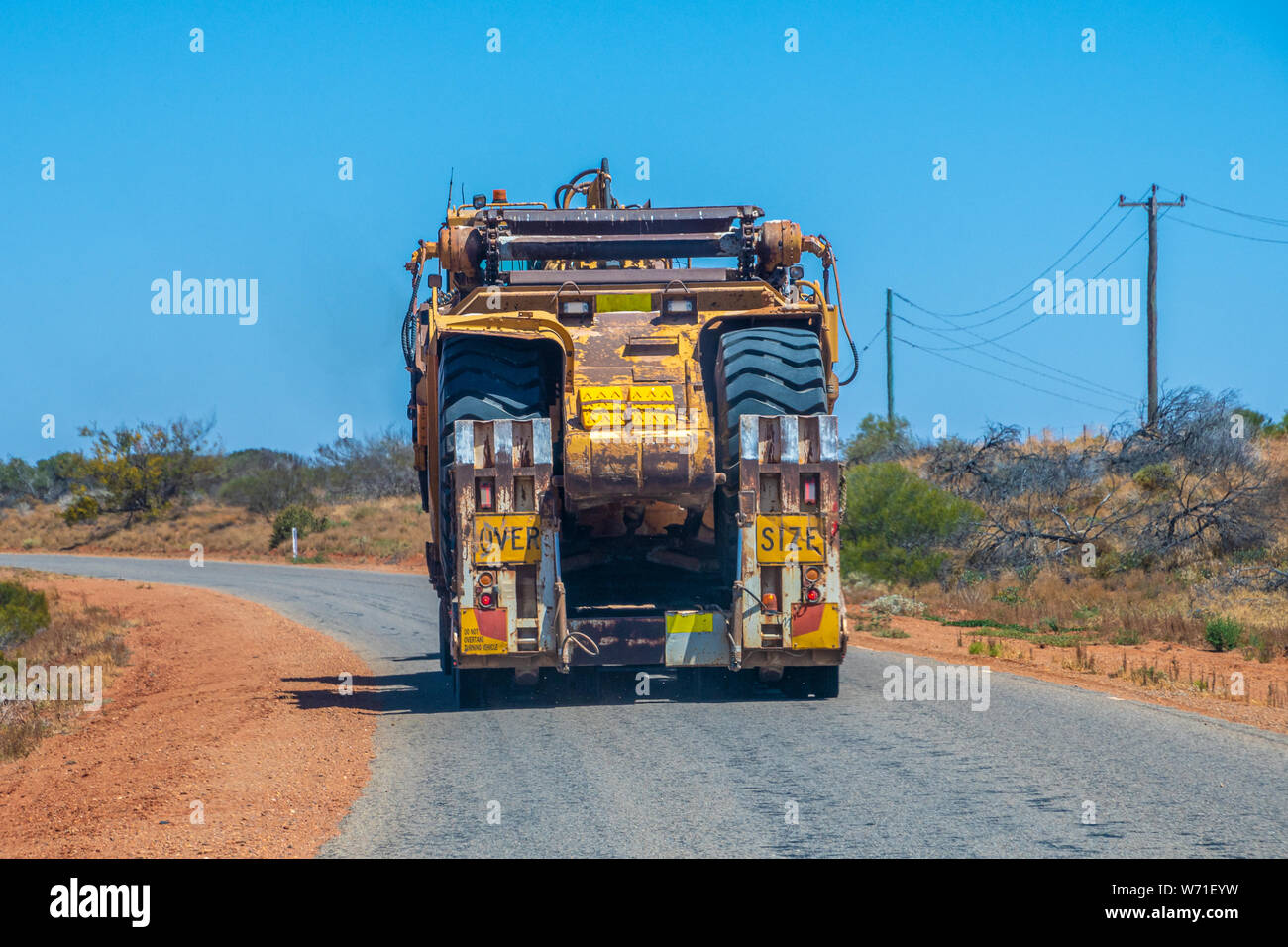 Road Train oversize load transport in Australia transporting big mining gear Stock Photo