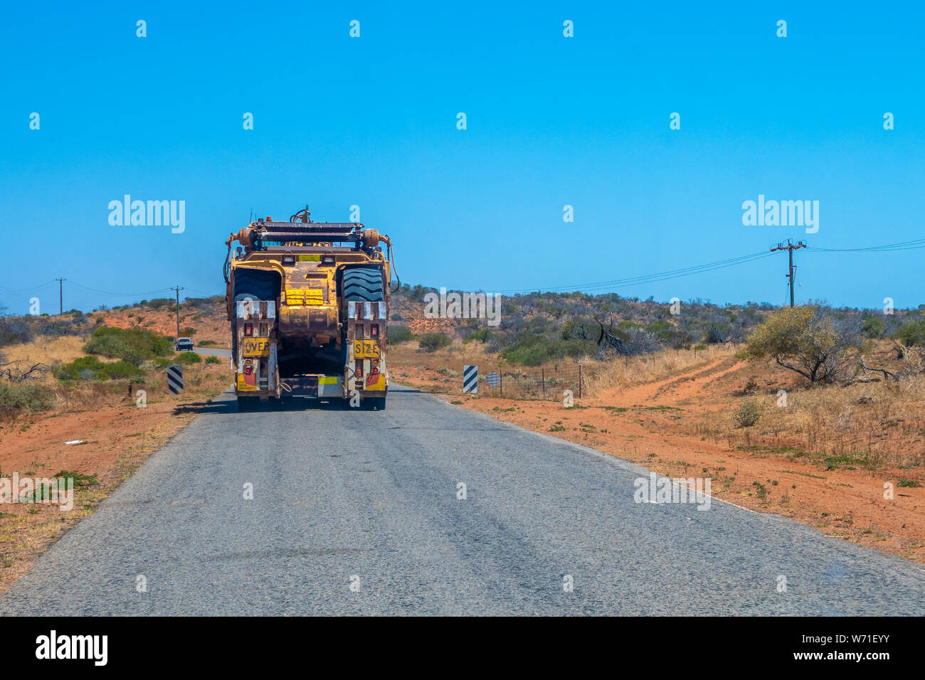 Road Train oversize transport in Australia transporting big mining gear Stock Photo