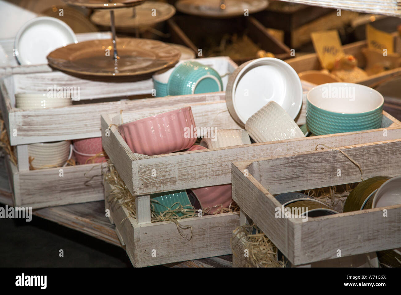 set of ceramic tableware in wooden boxes in kitchen Stock Photo Alamy