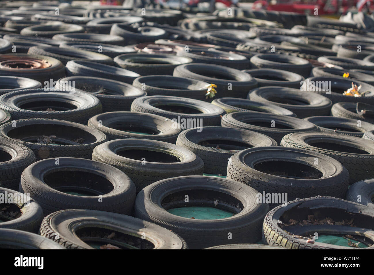 Old piled up car tires, background picture, Germany Stock Photo