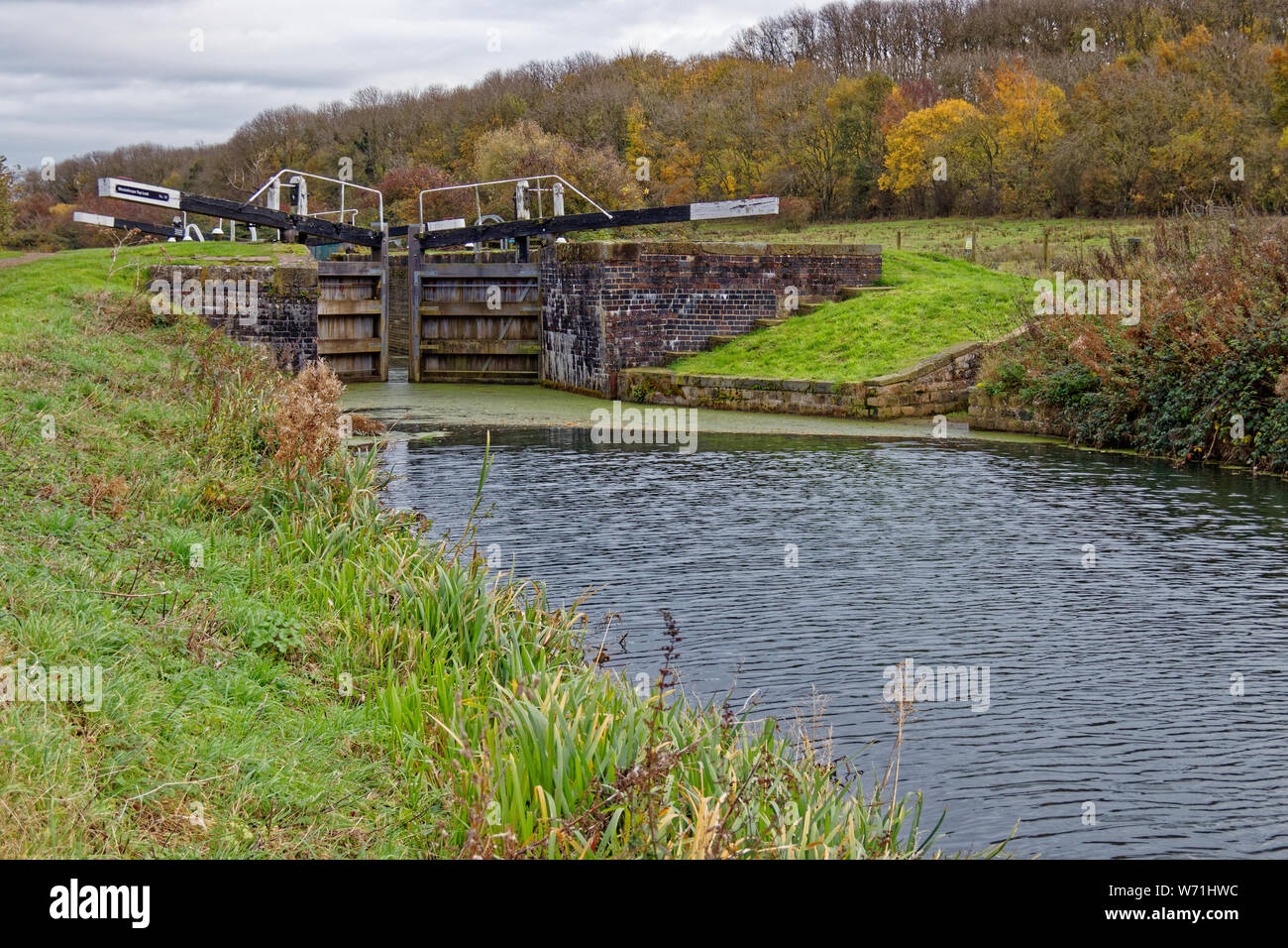 A low point of view of Woolsthorpe Locks at Woolsthorpe by Belvoir on the Grantham Canal in Lincolnshire in the autumn Stock Photo