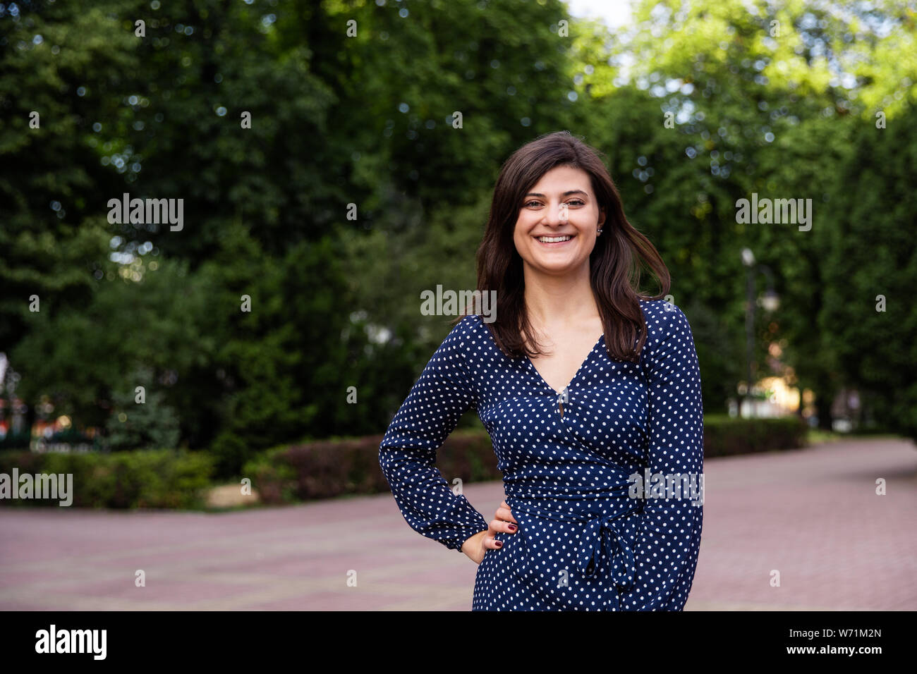 Portrait of beautiful young woman laughing at camera Stock Photo