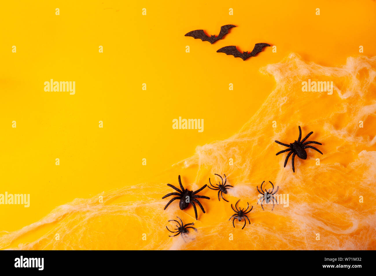 Halloween scene on orange background Stock Photo - Alamy