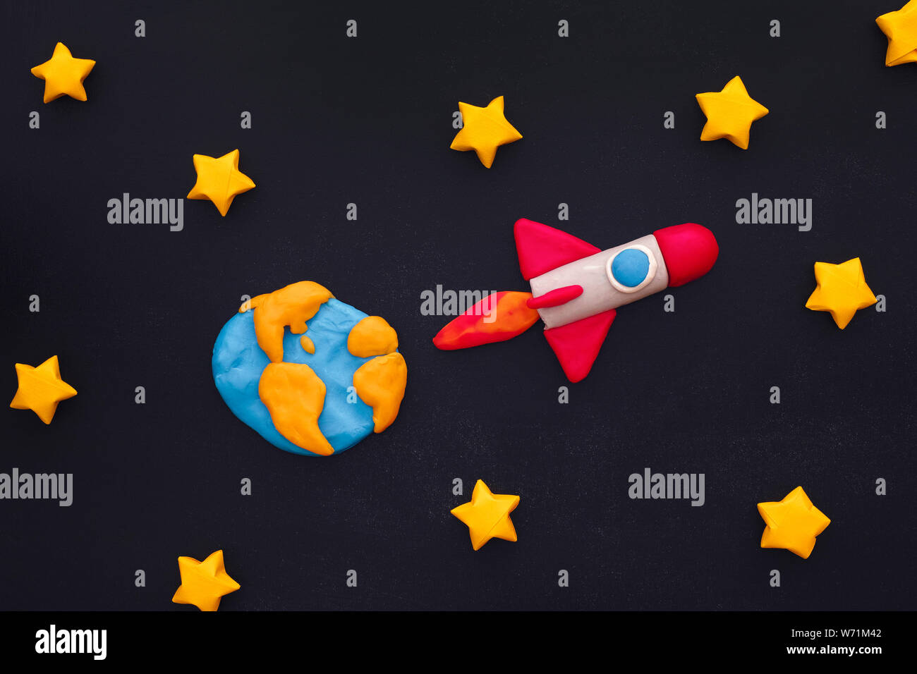 Space Rocket Flying Through The Stars On Blackboard Space Rocket And Planet Earth Are Made Out Of Play Clay Plasticine Stock Photo Alamy