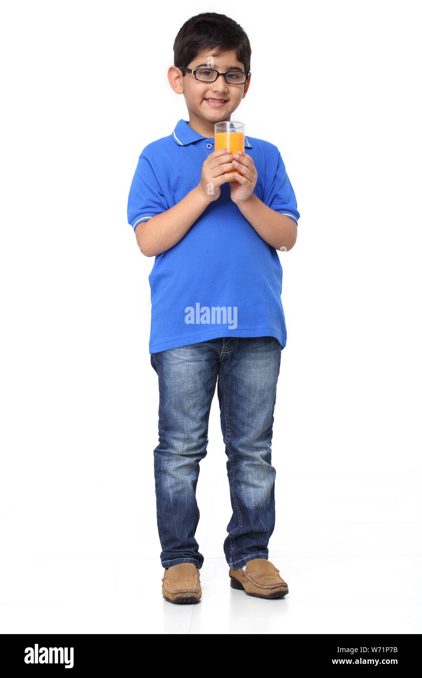 Boy holding a glass of juice Stock Photo