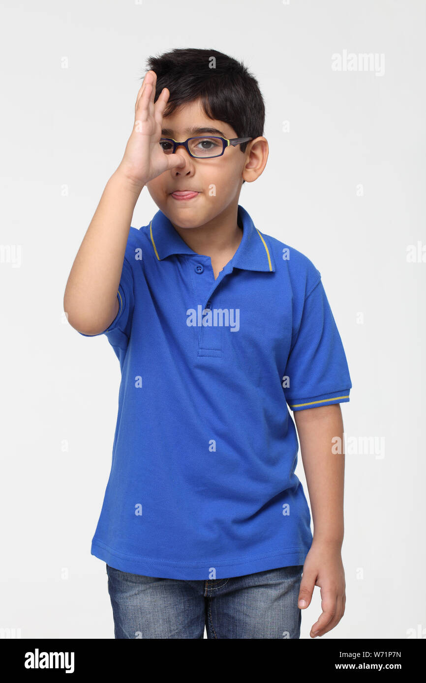 Indian boy making a funny face Stock Photo - Alamy