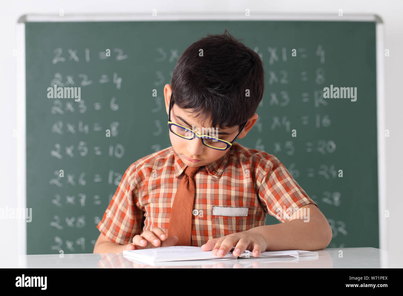 Schoolboy studying in a classroom Stock Photo