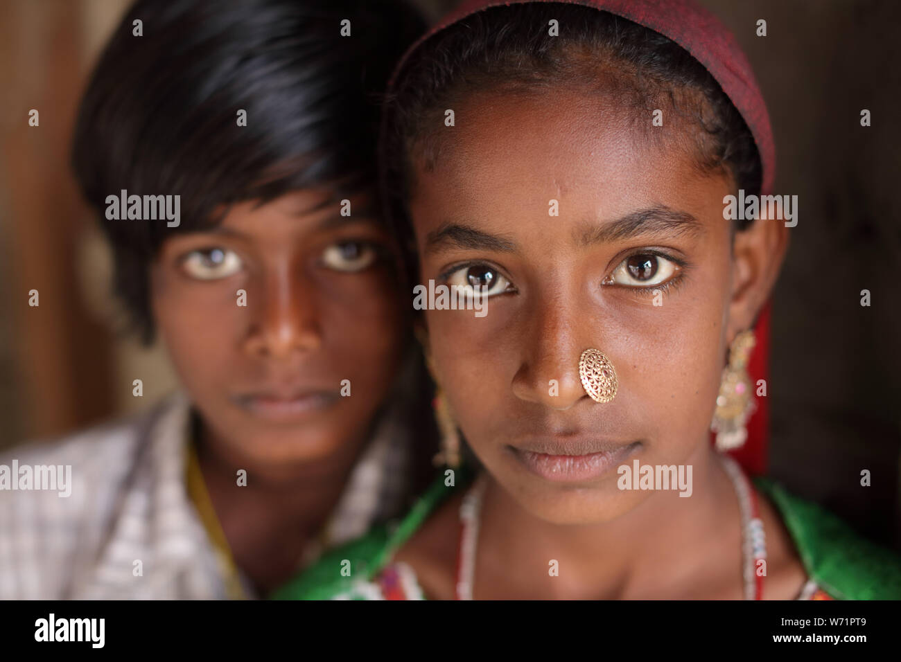 Tribal siblings in a rural village in the district of Kutch, Gujarat. The Kutch region is well known for its tribal life and traditional culture. Stock Photo