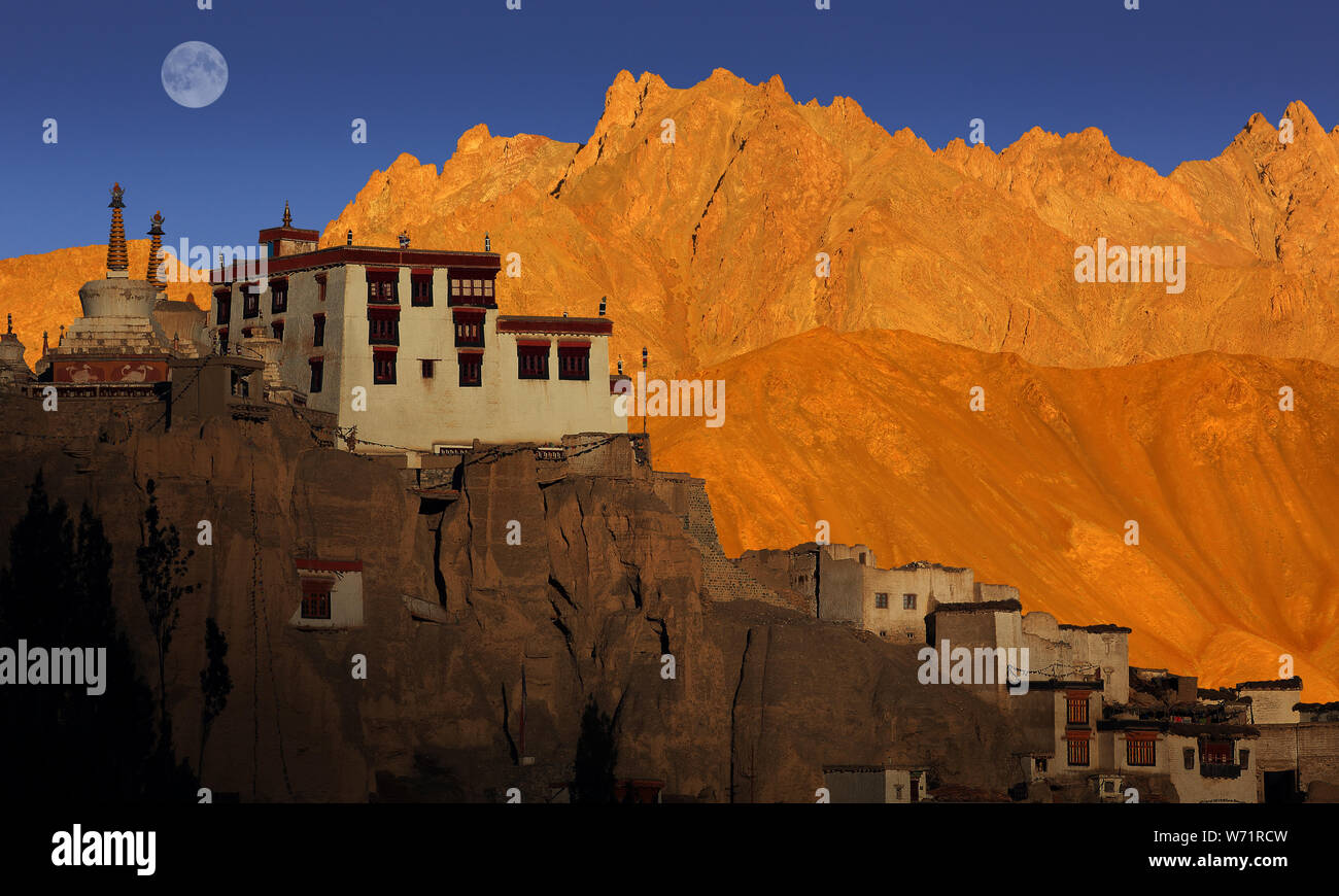 Lamayuru Buddhist monastery and scenic mountain view, sunset with full moon, Ladakh, India Stock Photo