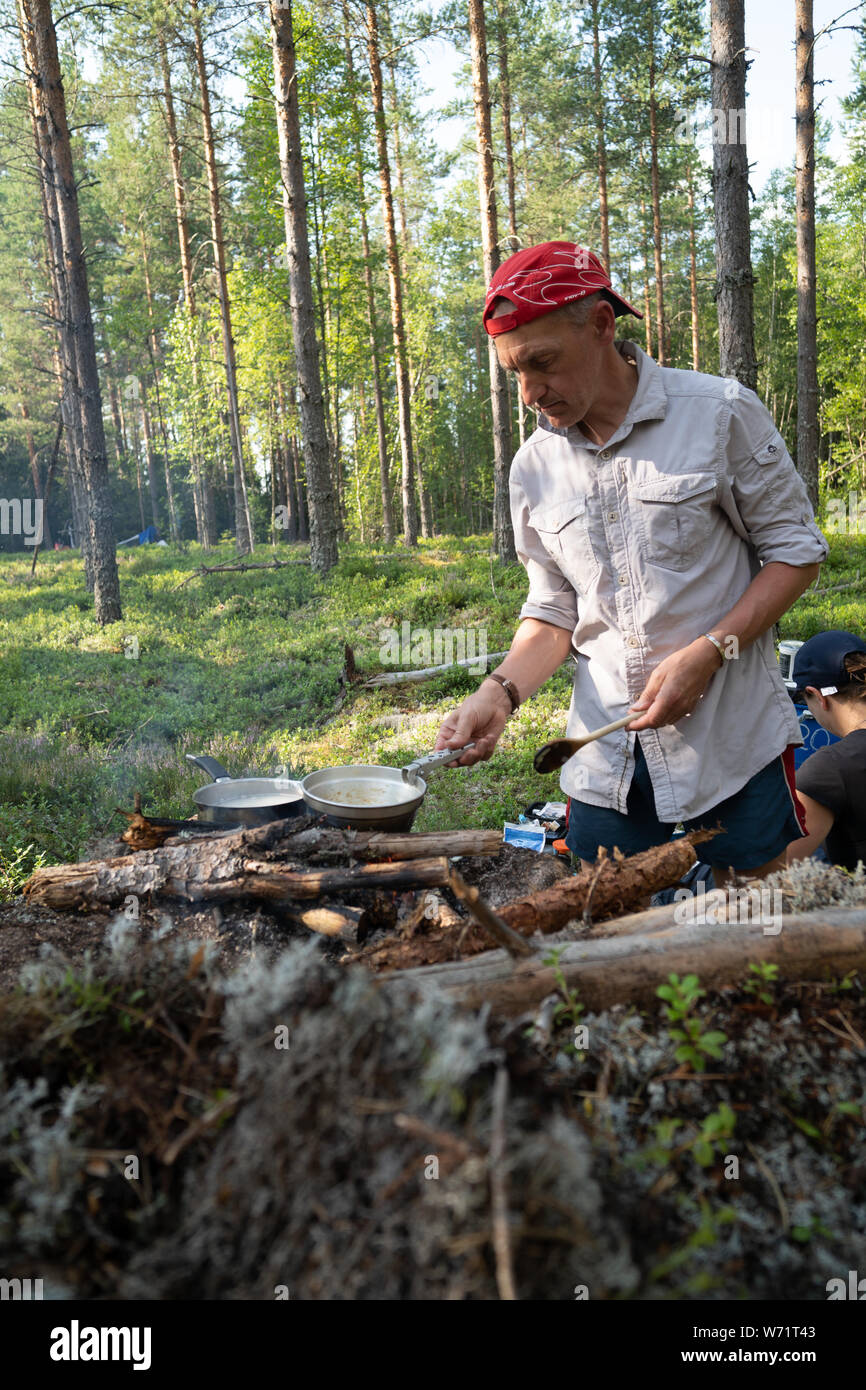 Friends wild camping in a forest Stock Photo