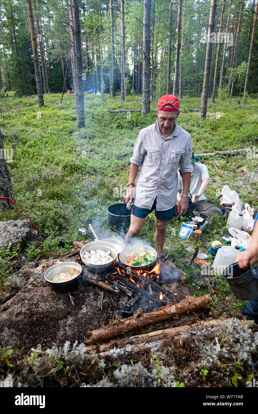 Friends wild camping in a forest Stock Photo