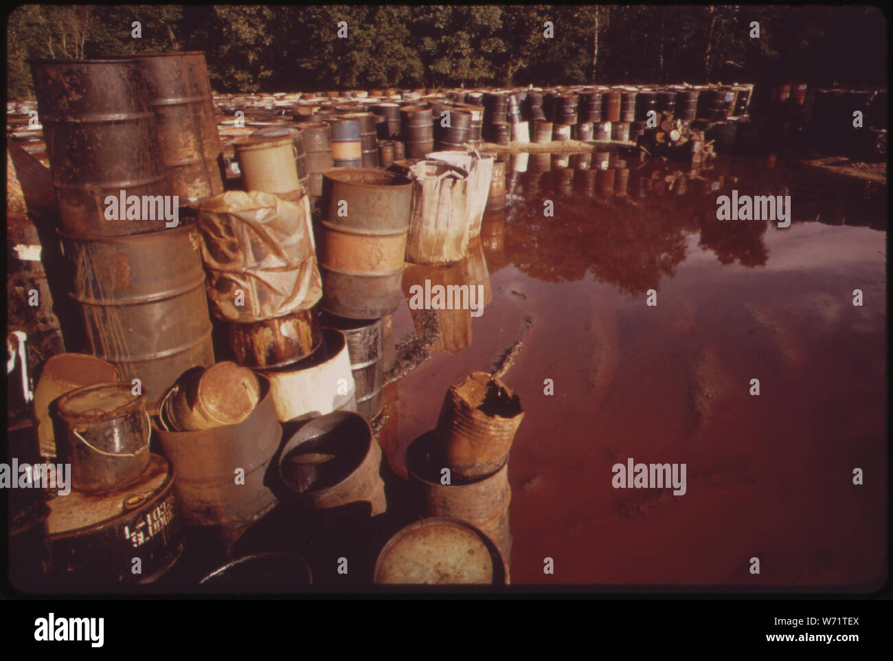 ABOUT 3,000 DRUMS CONTAINING HAZARDOUS INDUSTRIAL WASTES HAVE BEEN STORED FOR SIX MONTHS IN THIS