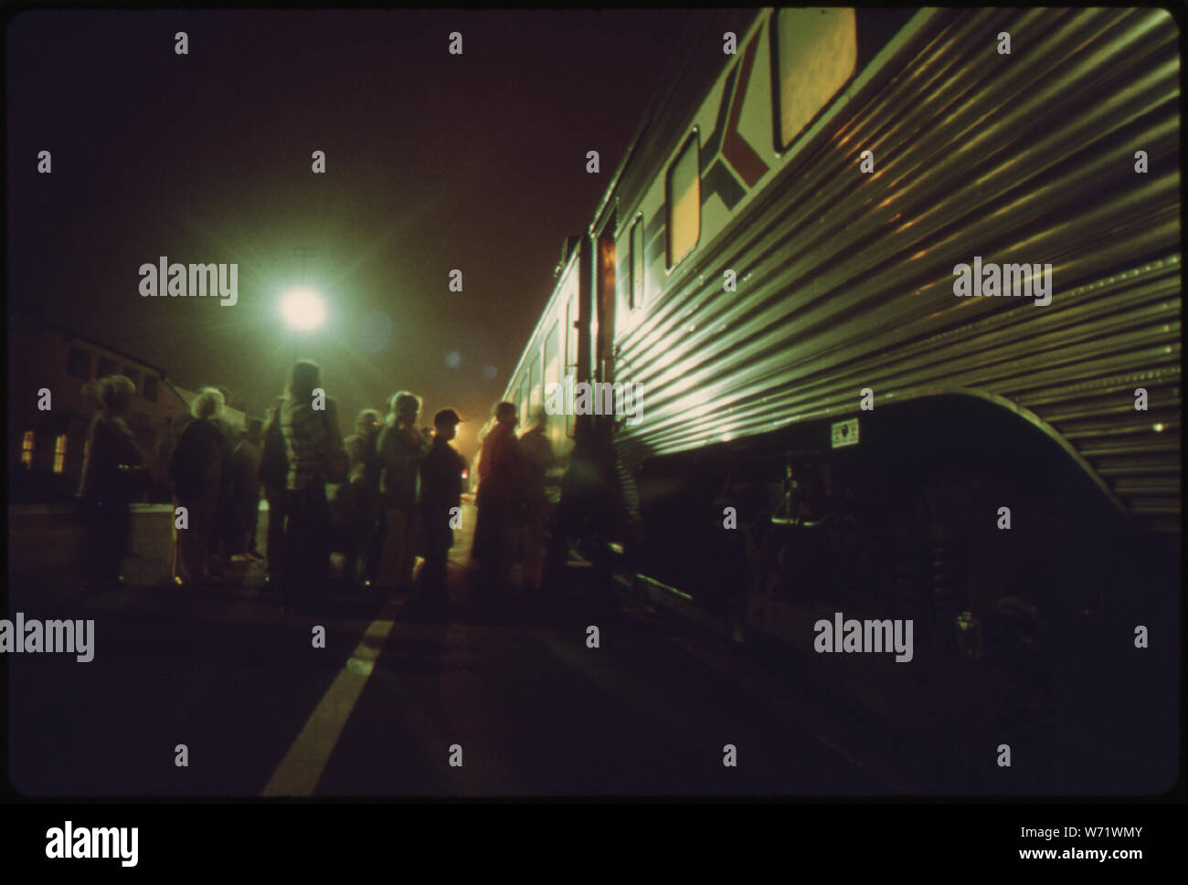AMTRAK PASSENGERS BOARD THE SOUTHBOUND SAN DIEGAN AS IT MAKES A
