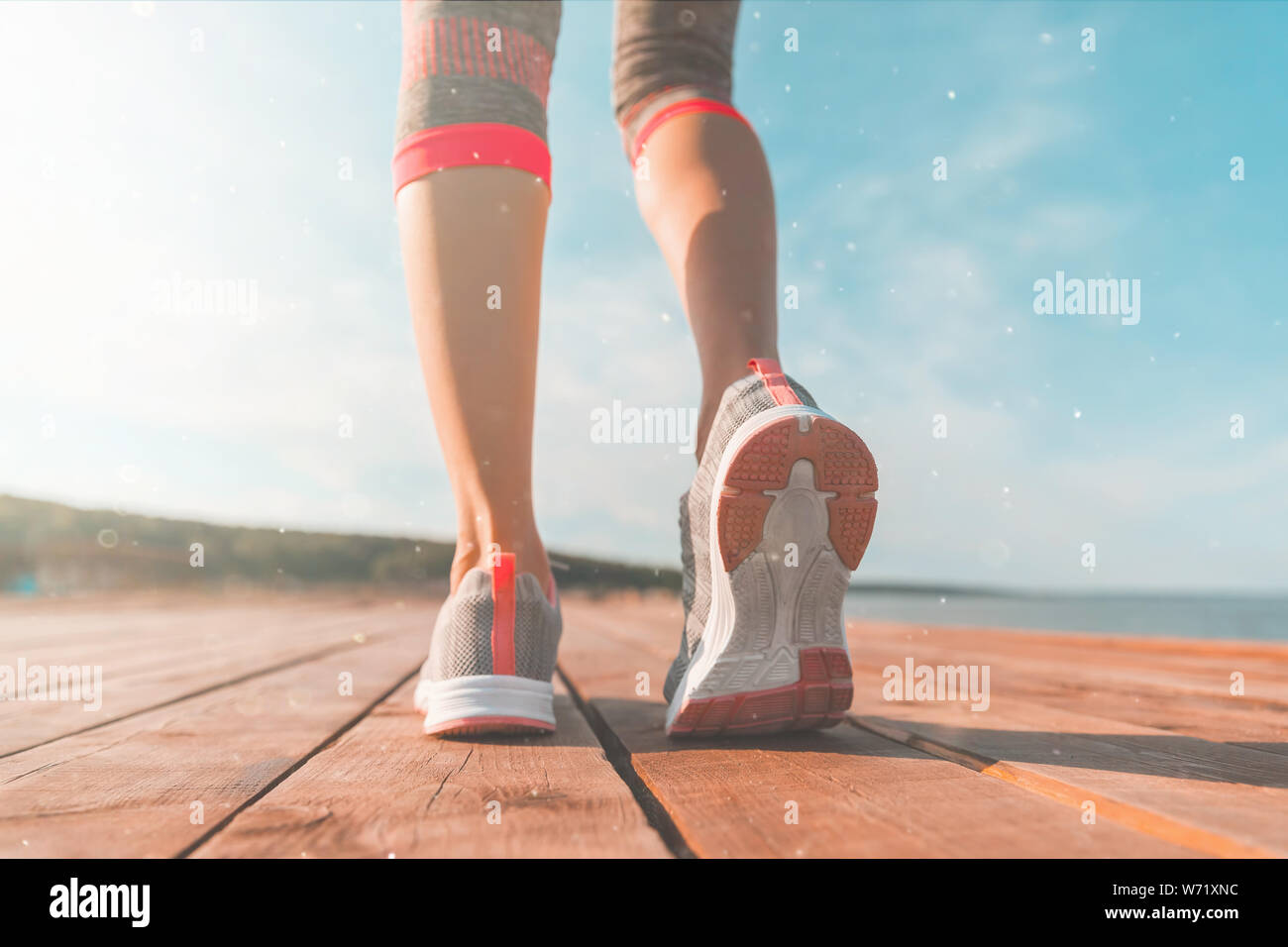 Legs in sneakers close-up. Health and Yoga Concept. Rear view close up  strong athletic female legs and running shoes of sport. Woman do gymnastics  out Stock Photo - Alamy