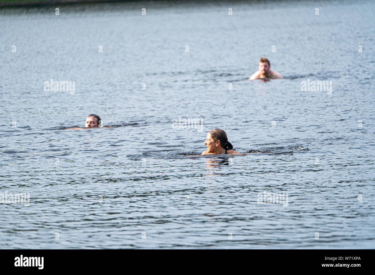 People wild swimming in the Black River (Svartälven), Sweden Stock Photo