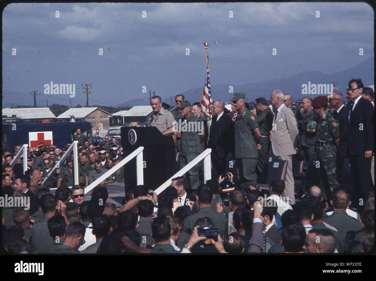 Cam Rahn Bay, Republic of Vietnam...President of the United States, Lyndon B. Johnson, Addresses U.S. Troops During a visit to Cam Ranh Bay. Attending the ceremony are Rear Admiral Kenneth L. Veth, U.S. Navy (second from left), commander U.S. Naval Forces, Vietnam; General William C. Westmoreland, USA (second row, second from right), commander U.S. Military Assistance Command, Vietnam, and the Honorable Ellsworth Bunker, U.S. Ambassador to the Republic of Vietnam. Stock Photo