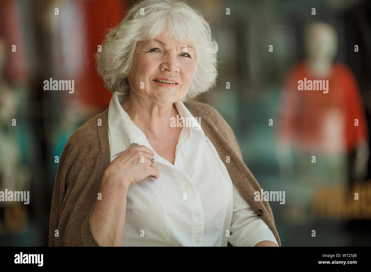 Portrait of beautiful senior woman in a shopping center Stock Photo - Alamy