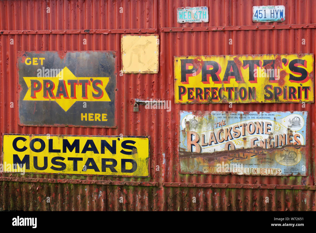 Enameled metal advertising boards or signs from a bygone era with