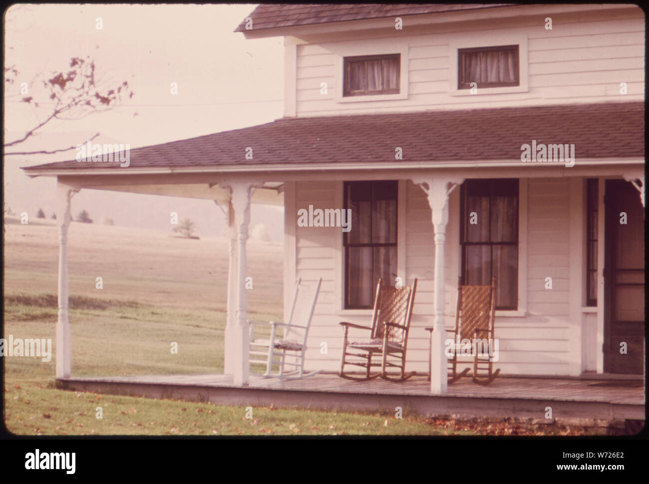 EMPTY ROCKING CHAIRS ON AN OLD FARMHOUSE PORCH ON ROUTE 73 Stock Photo -  Alamy