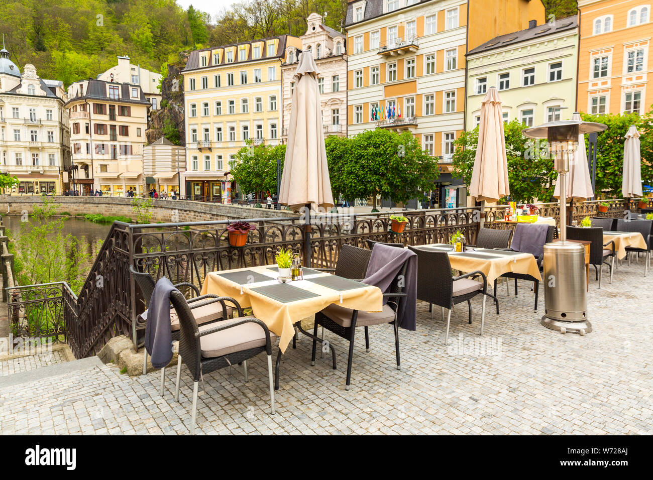 Cosy outdoor cafe with view on river, Karlovy Vary Stock Photo - Alamy
