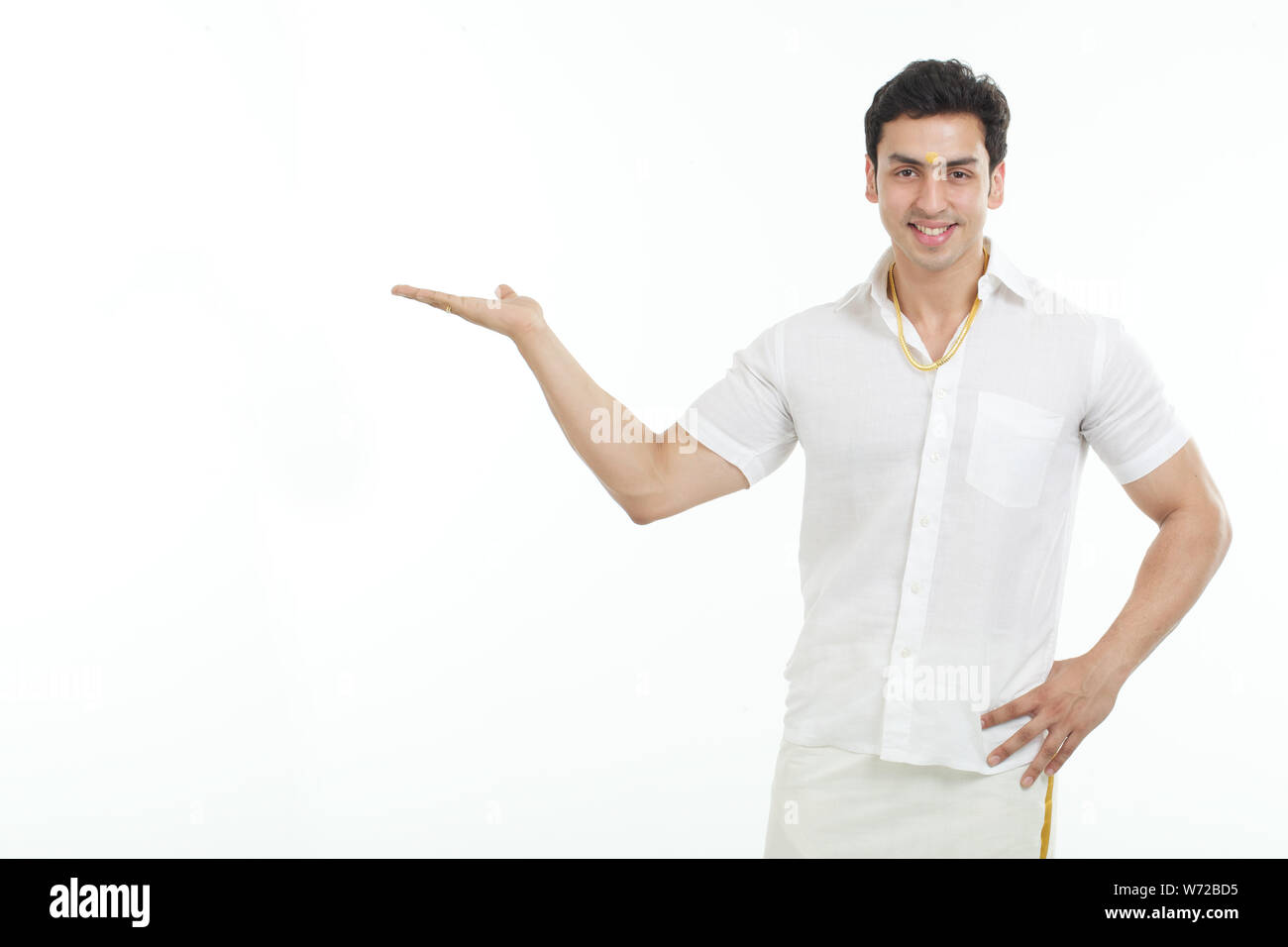 South Indian man smiling and gesturing Stock Photo