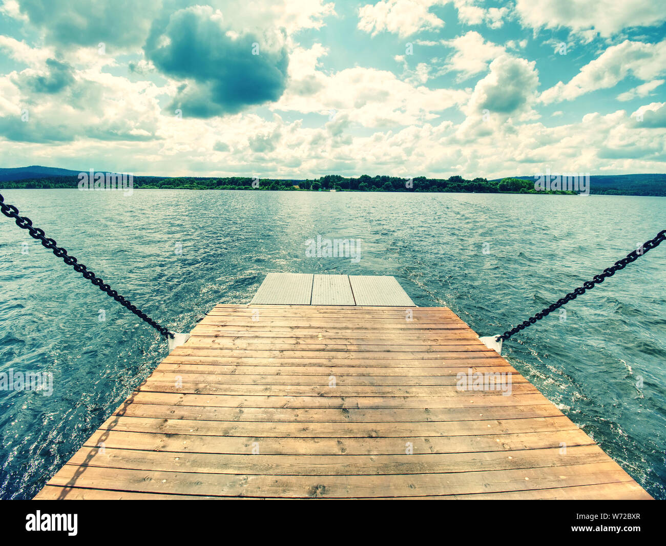 Shipping on Ferry Boat Ship with open Ramp and empty Car Deck. Wooden board for cars and passenger Stock Photo