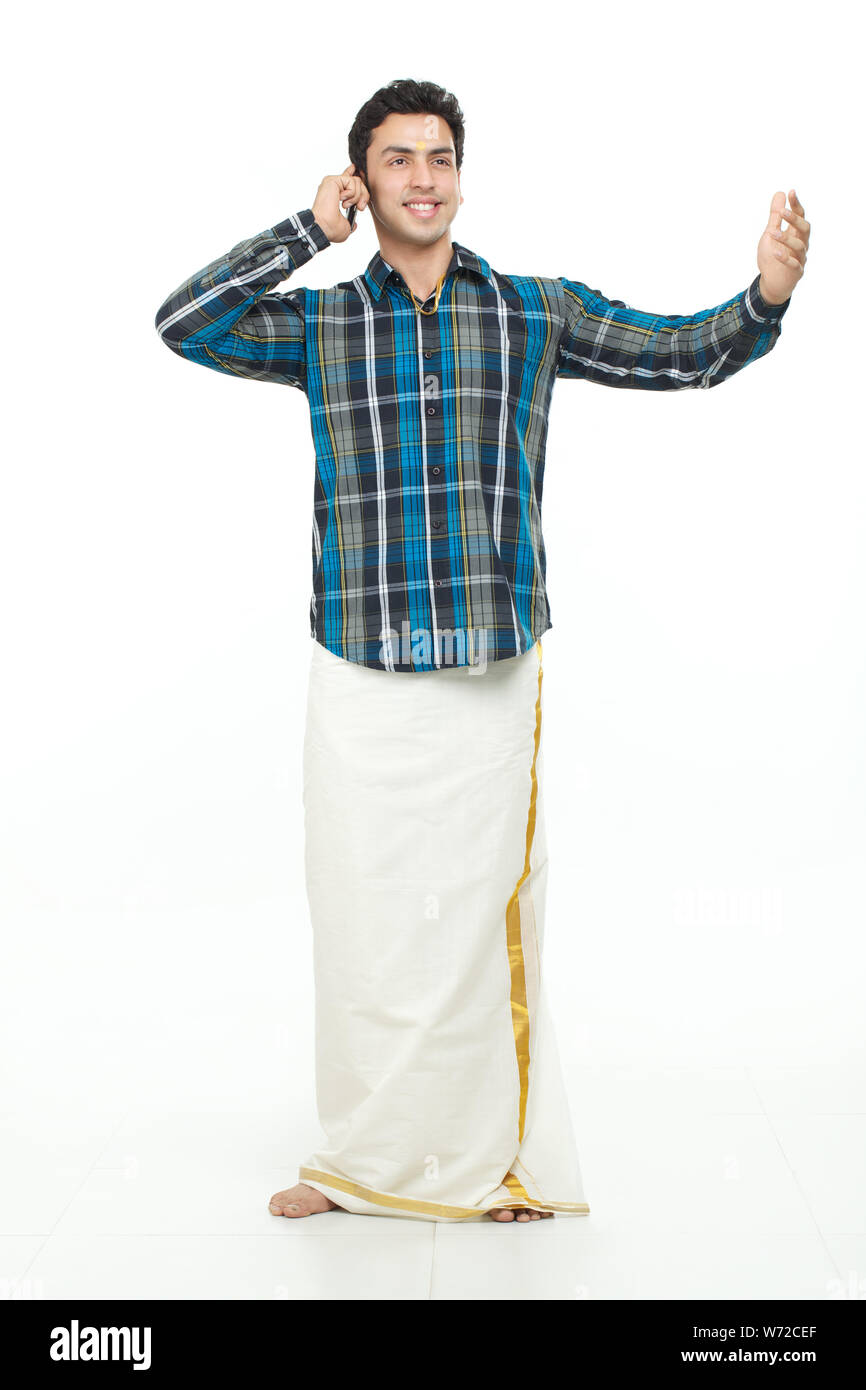 South Indian man talking on mobile phone Stock Photo