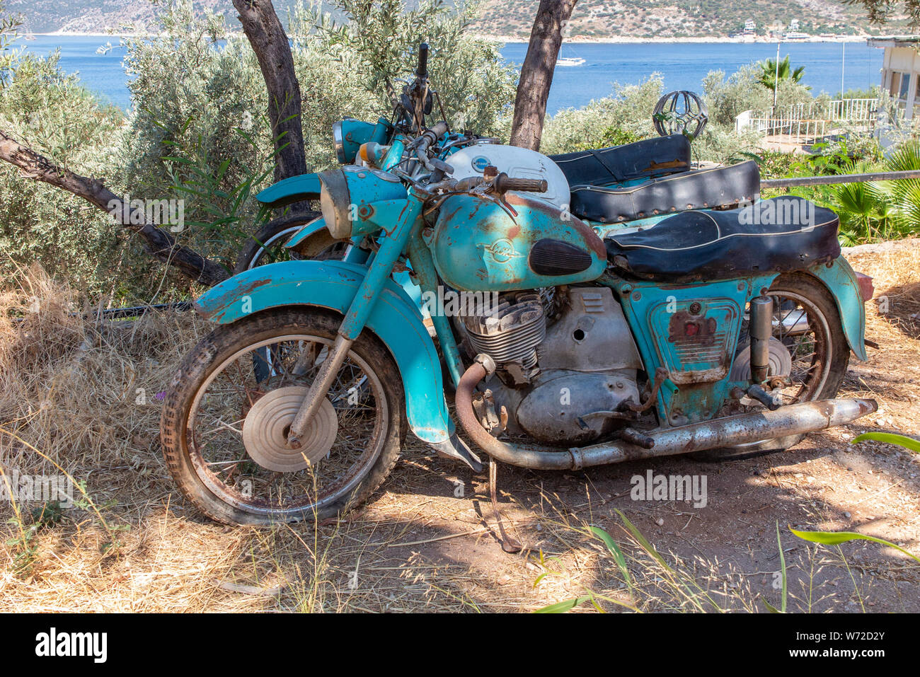 Rusting, abandoned Russian retro soviet motorcycles made by Izh -Planeta  Stock Photo - Alamy