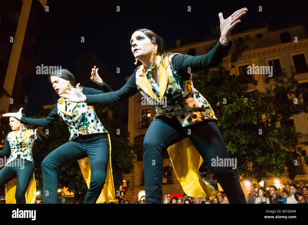 Granada, Andalusia, Spain- May 3rd, 2019 : Women dance flamenco during a public performance on the Dia de la Cruz festivity. Stock Photo