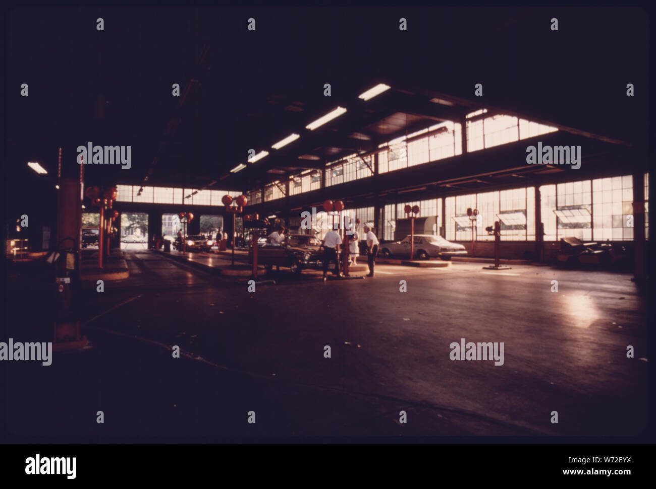 INTERIOR OF AN AUTO EMISSION INSPECTION STATION IN DOWNTOWN CINCINNATI, OHIO, WITH EMPLOYEES IN
