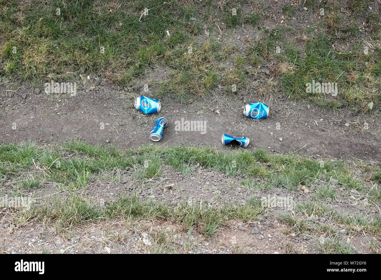 August 2019 - Beer cans dumped in a ditch,probably out of a car window in the beautiful Somerset village of Cheddar Stock Photo