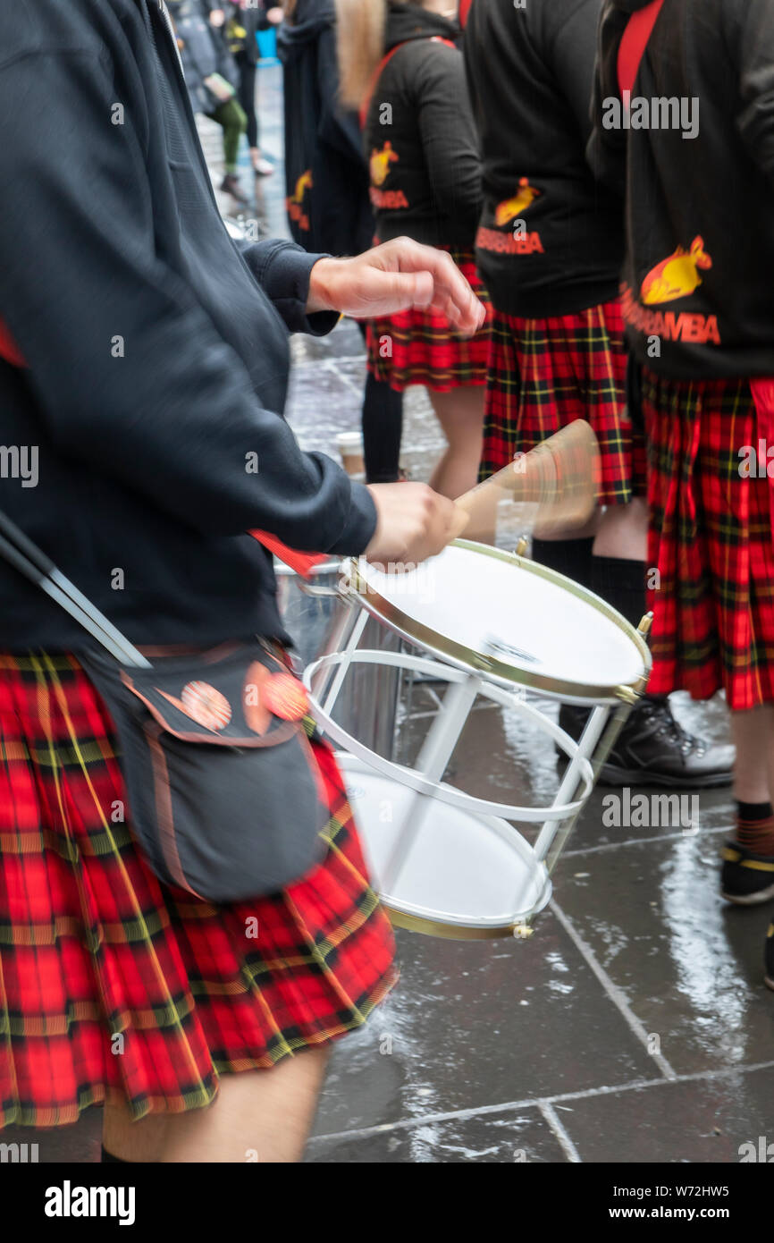 music band with traditional Scottish kilts performing in Glasgow city ...