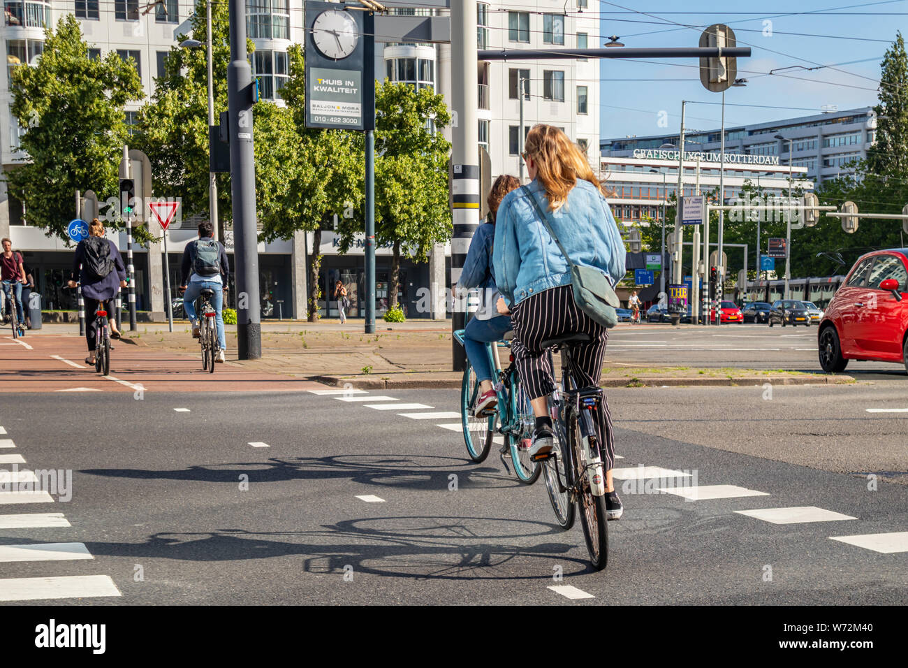 Rotterdam, Netherlands. June 27, 2019. People riding bikes in the city center, Spring sunny day Stock Photo